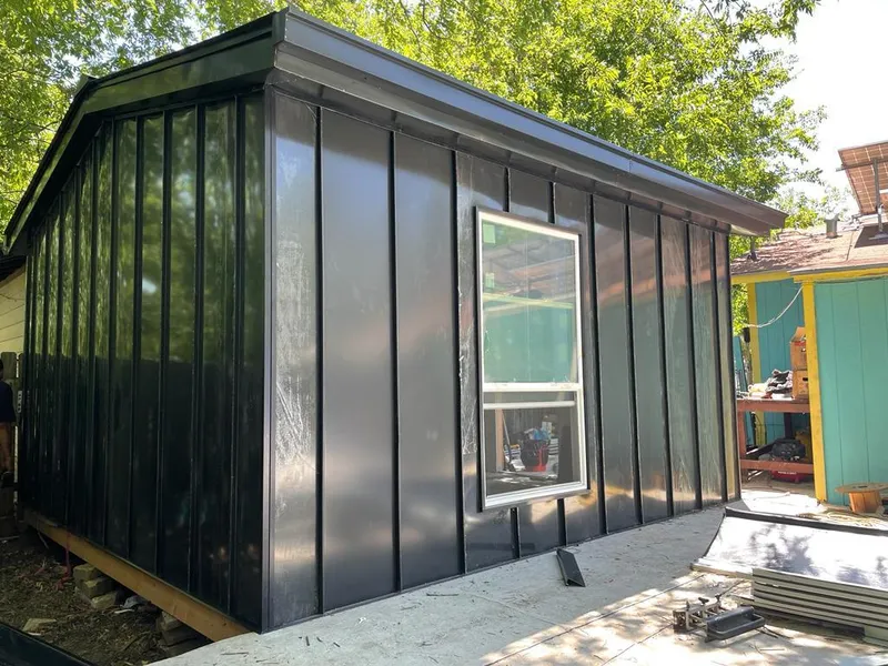 Black standing seam metal wall panels for Metal Roof Installation in Shelburne