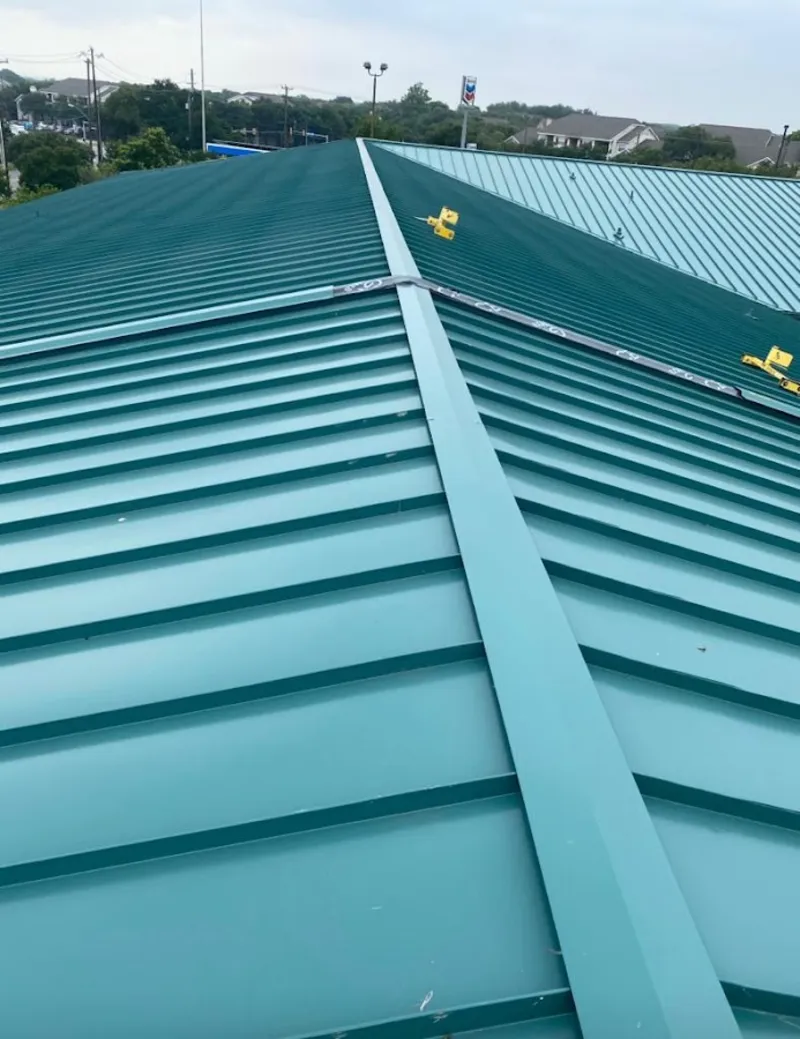 Green commercial metal roof ridge and valley for Metal Roof Repair in Shelburne